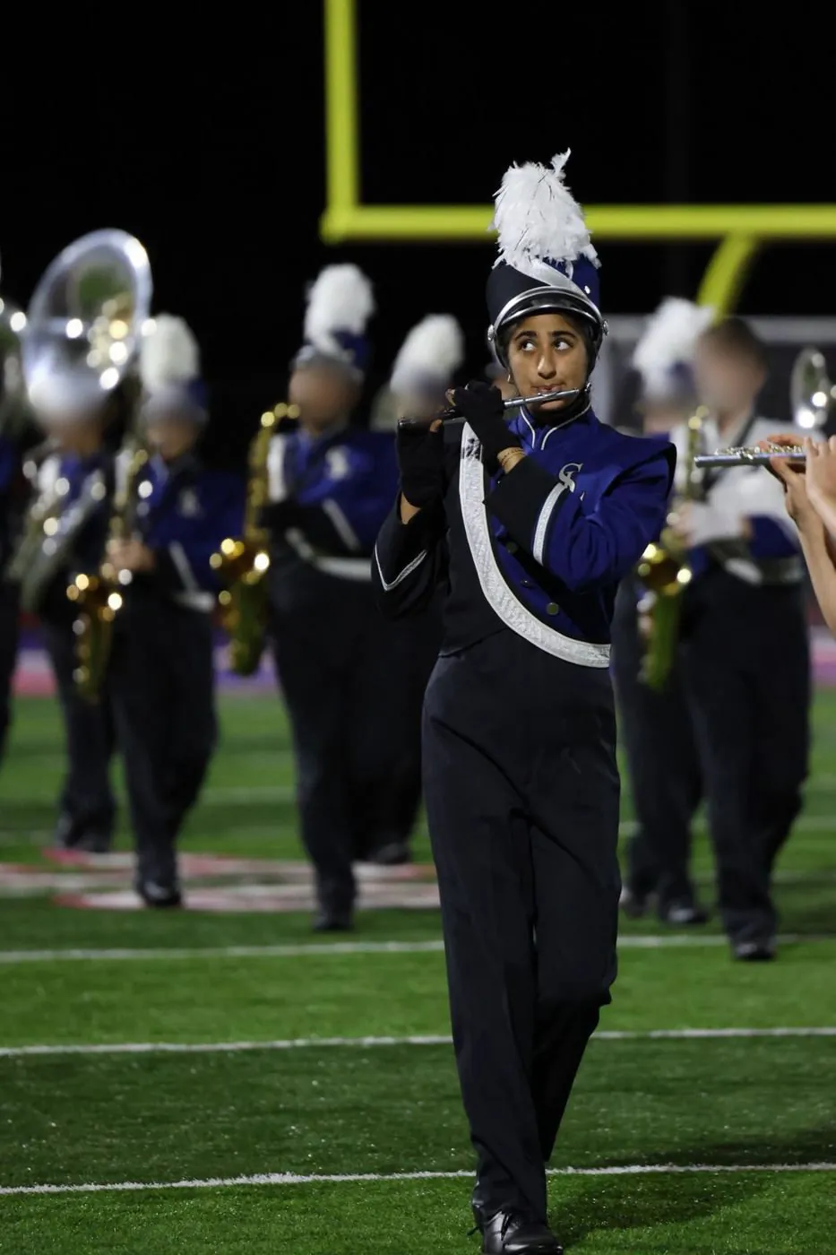 Aanya marching with the Southern Lehigh band on the football field at night
