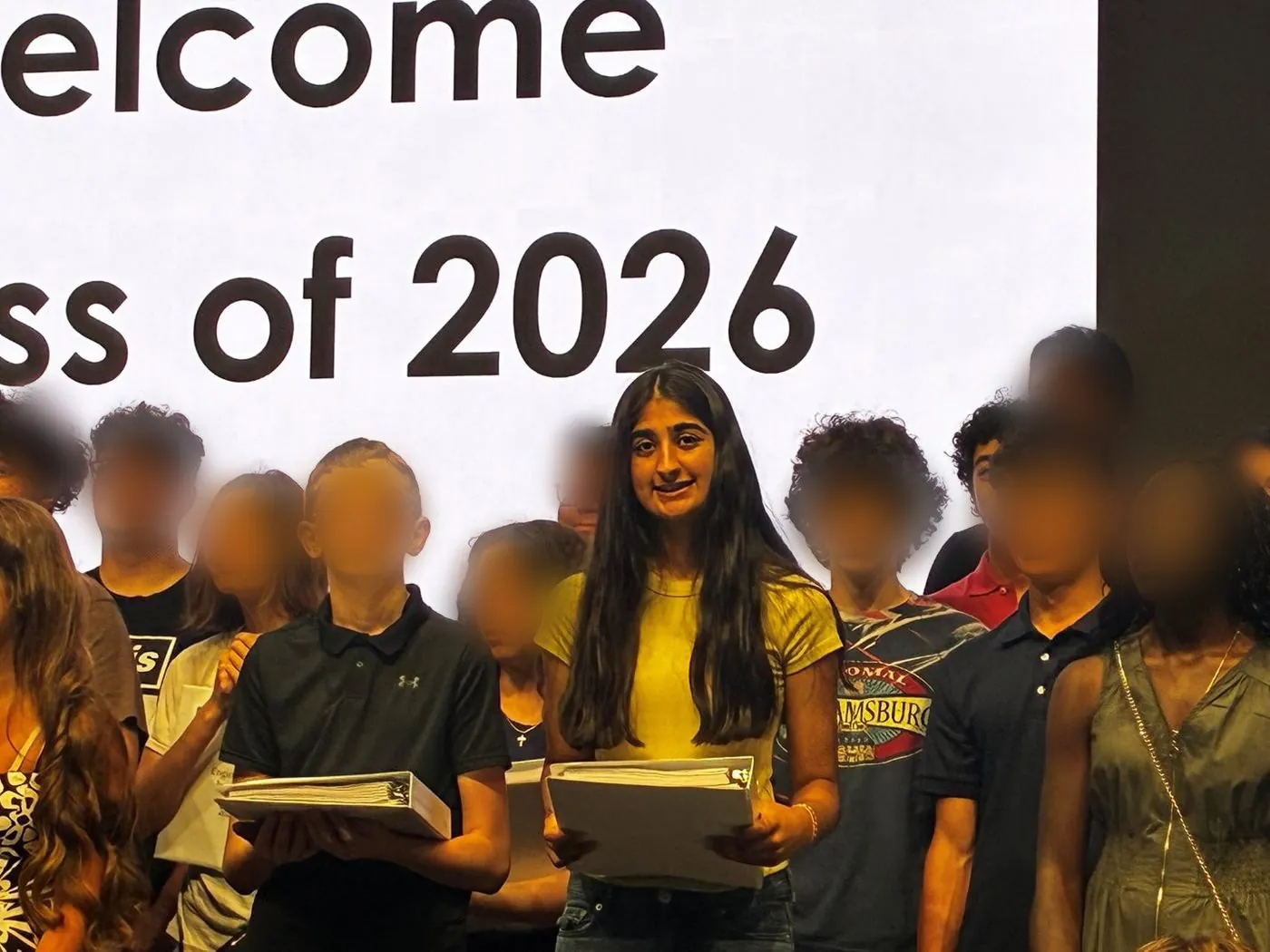 Aanya with fellow students under a Welcome Class of 2026 screen at Lehigh University